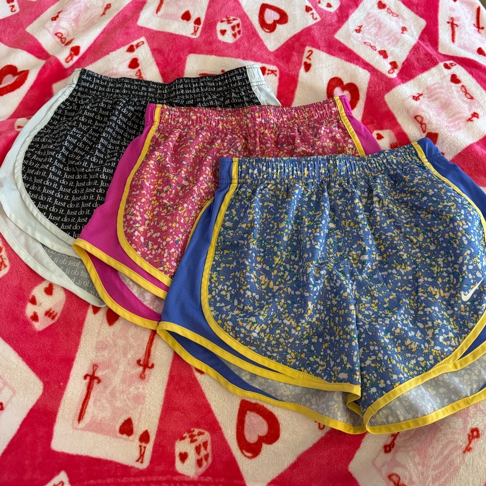 Nike Women's Shorts: “just do it” print, pink splatter, and blue splatter
